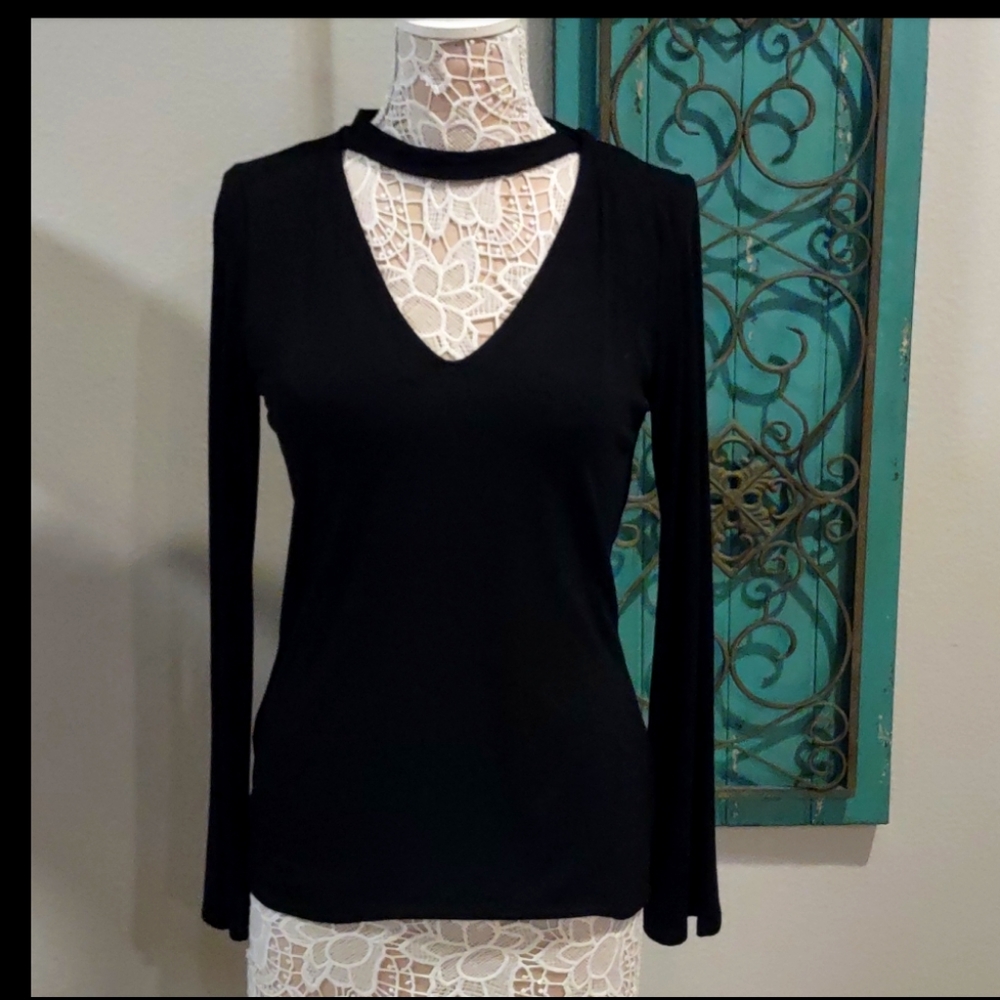 Brand new! Black long sleeve crew neck cut out top